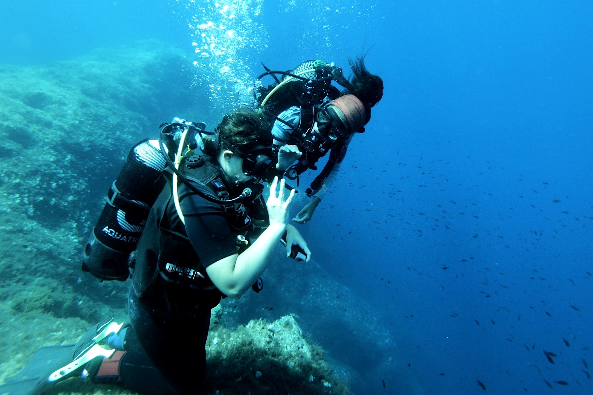 Instructor and student scuba diving in Malta