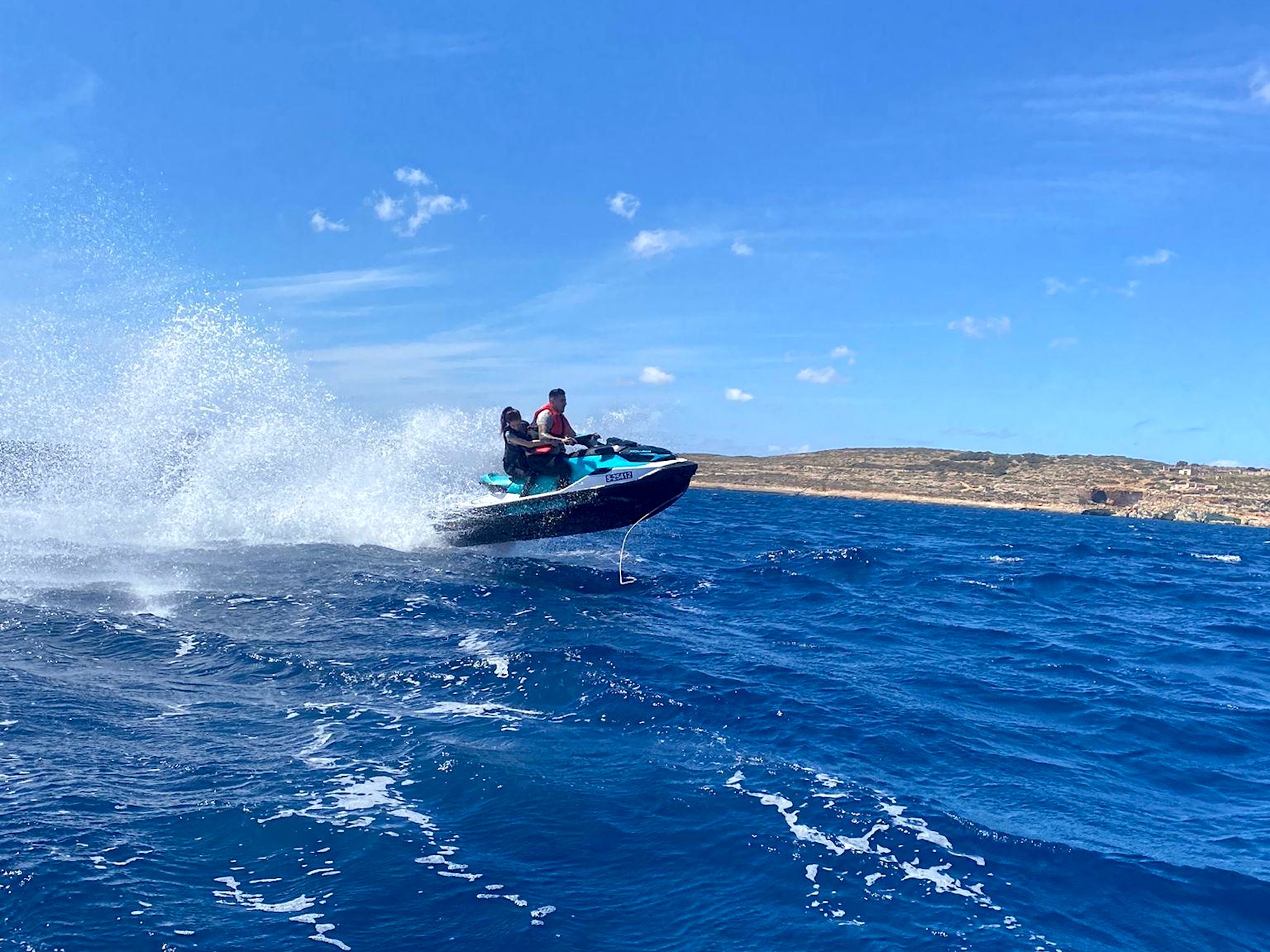 Two people on a jet ski in the air, Malta