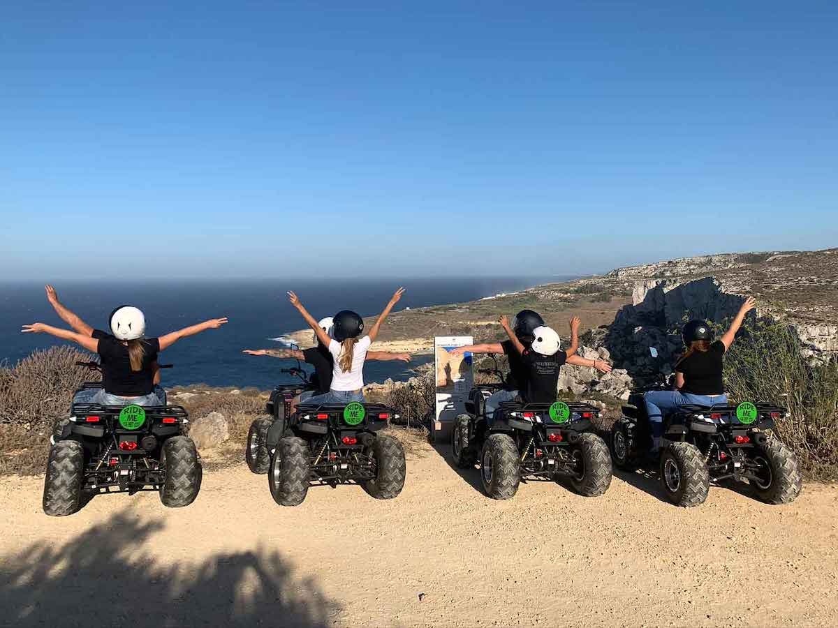 Quad biking in Gozo Group riding quads along a country track in Gozo