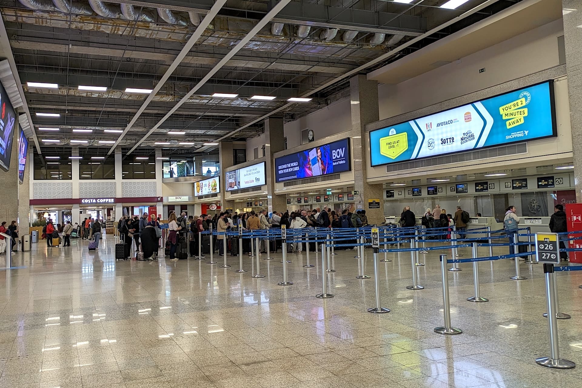 Traveling to Malta Lines of travelers at Malta airport