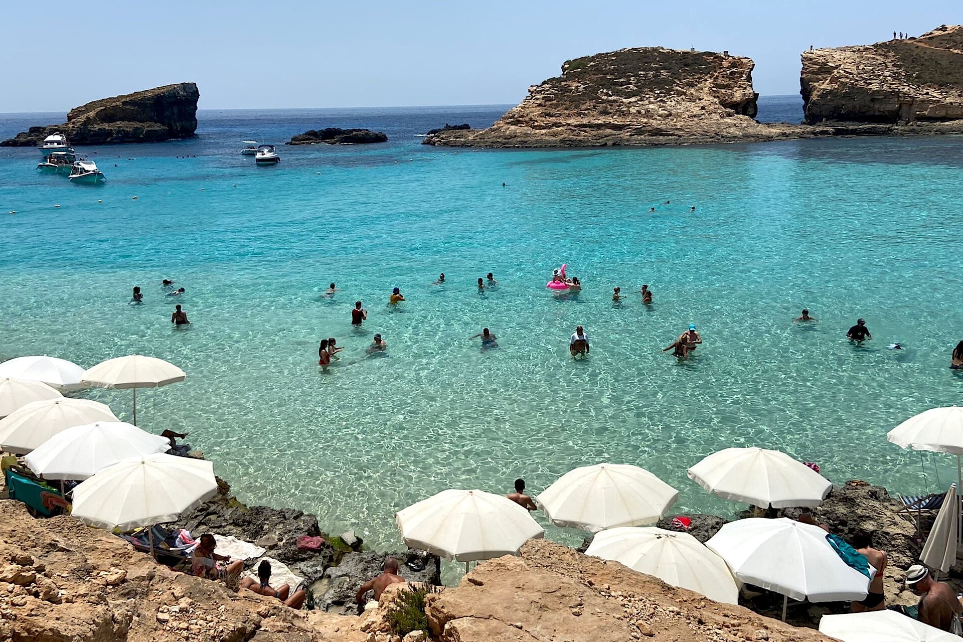 Parasols at the Blue Lagoon, Malta Row of parasols at the Blue Lagoon in Malta
