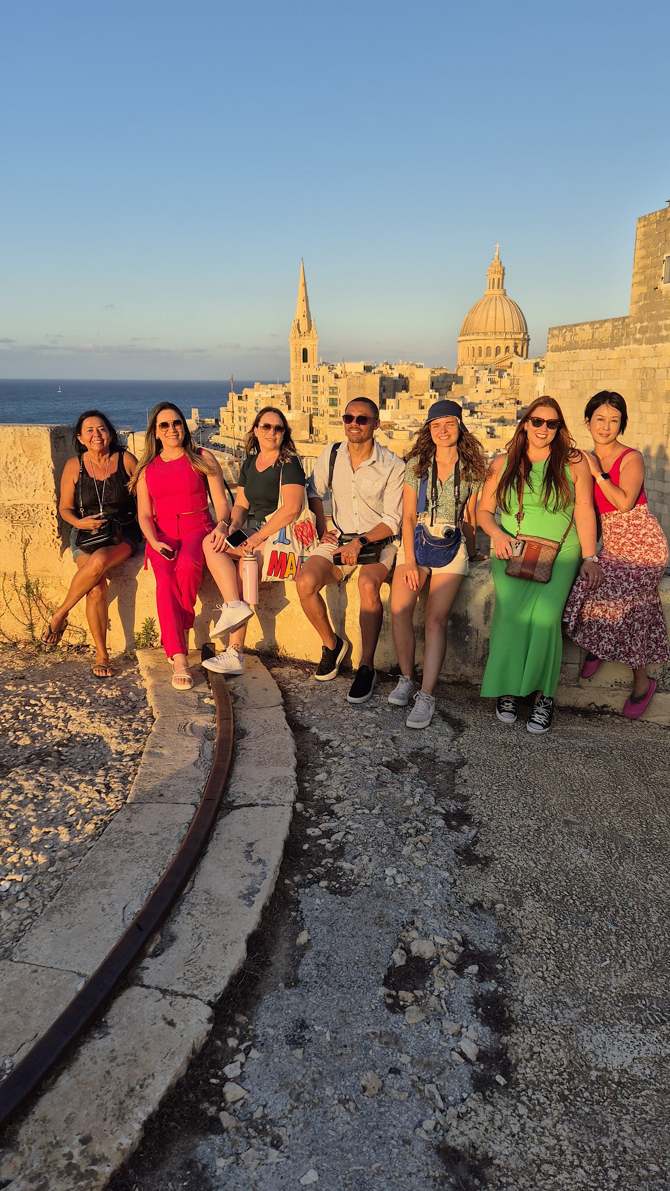 Easy School of Languages in Valletta Easy School of Languages students facing the Valletta skyline at sunset