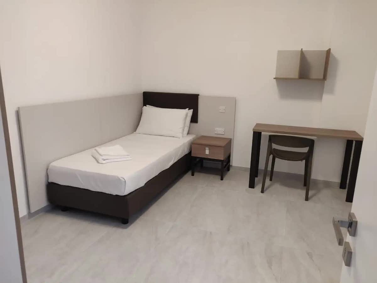 Claret apartment bedroom Bedroom of a Claret apartment offered by ESE Malta