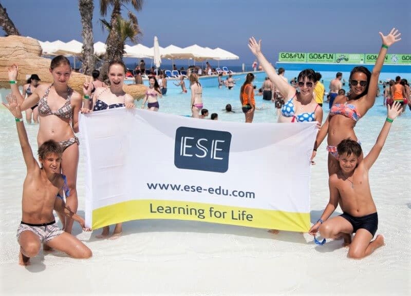 ESE Malta water park outing ESE Malta teens with the school flag at the water park