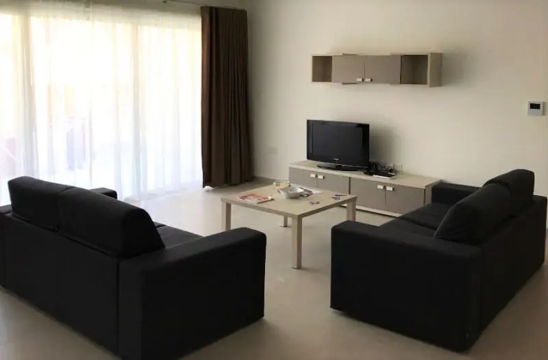 Sala de estar com sofá apartamento Astolat ESE