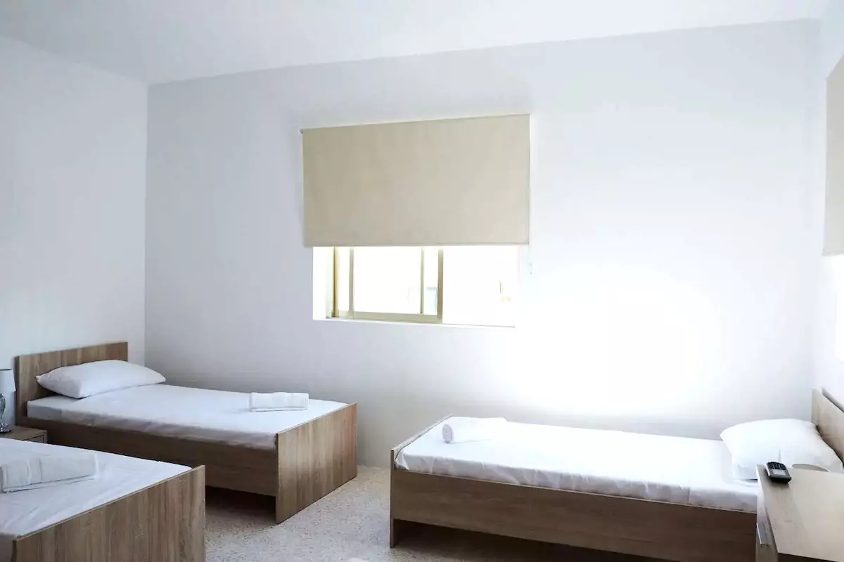 Bedroom in an Economical ESE Apartment with Three Beds