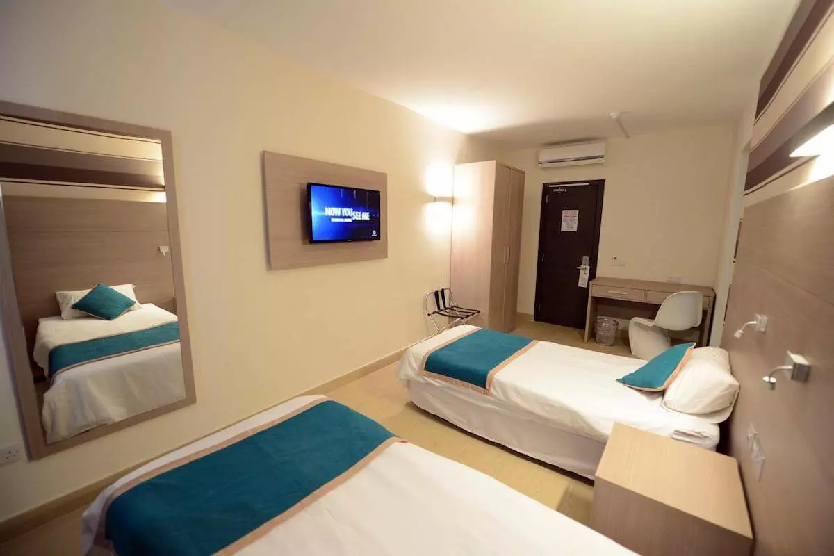 Room with two single beds at Day's Inn Sliema residence