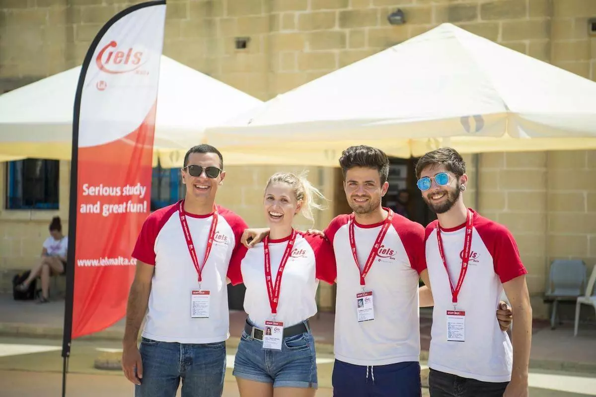 4 members of the IELS Malta team leading young students