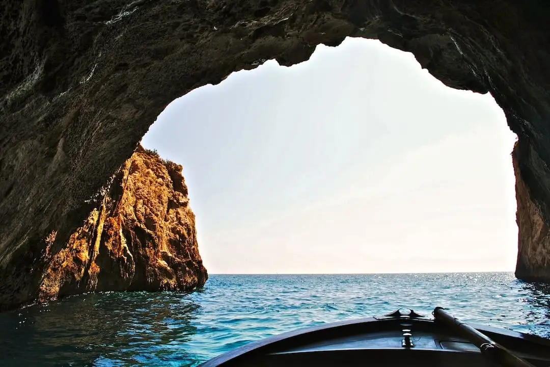 Boat exiting a cave