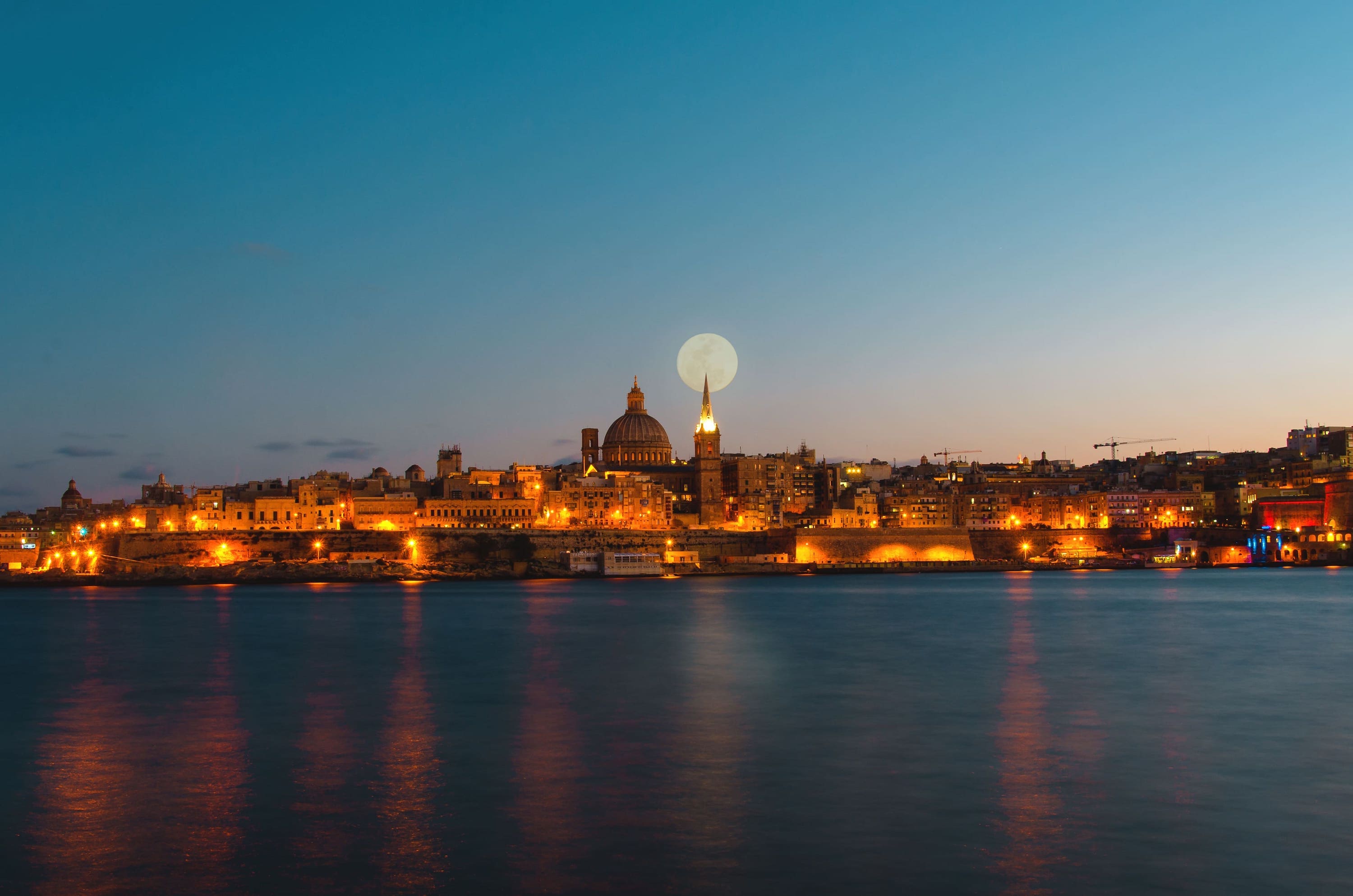 Valletta viewed at night with the Moon