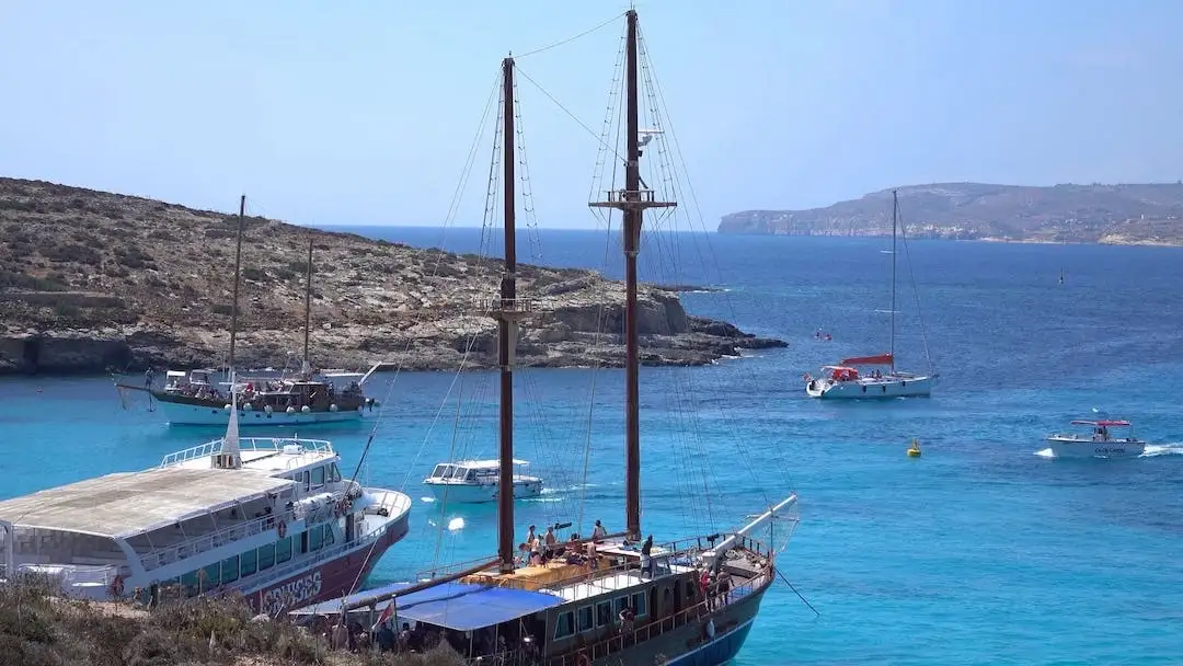Several boats in the Blue Lagoon of Malta