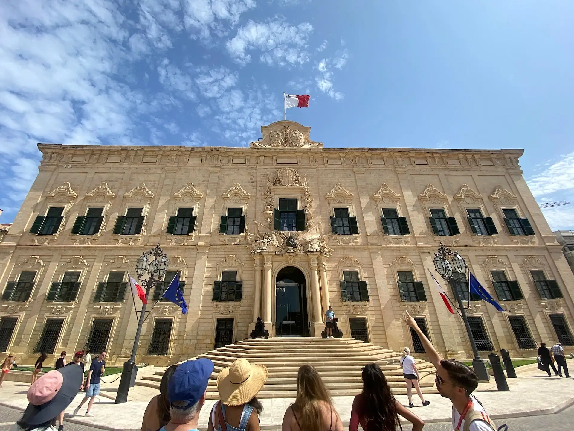 Tour guide and group in a Valletta alley