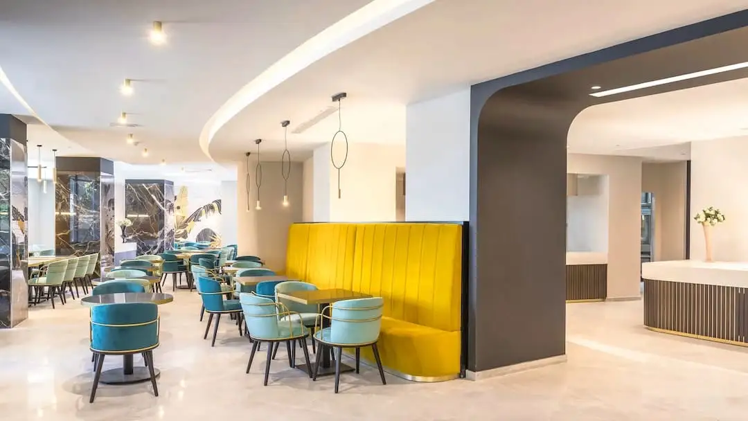 Lobby with chairs and a sofa at the Barceló Fortina in Malta