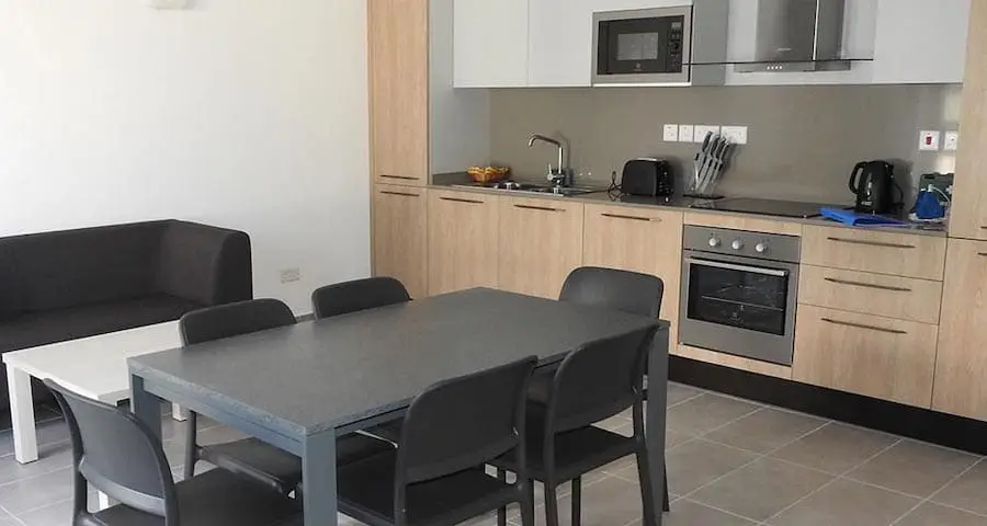 Living room with a kitchen in a modern apartment