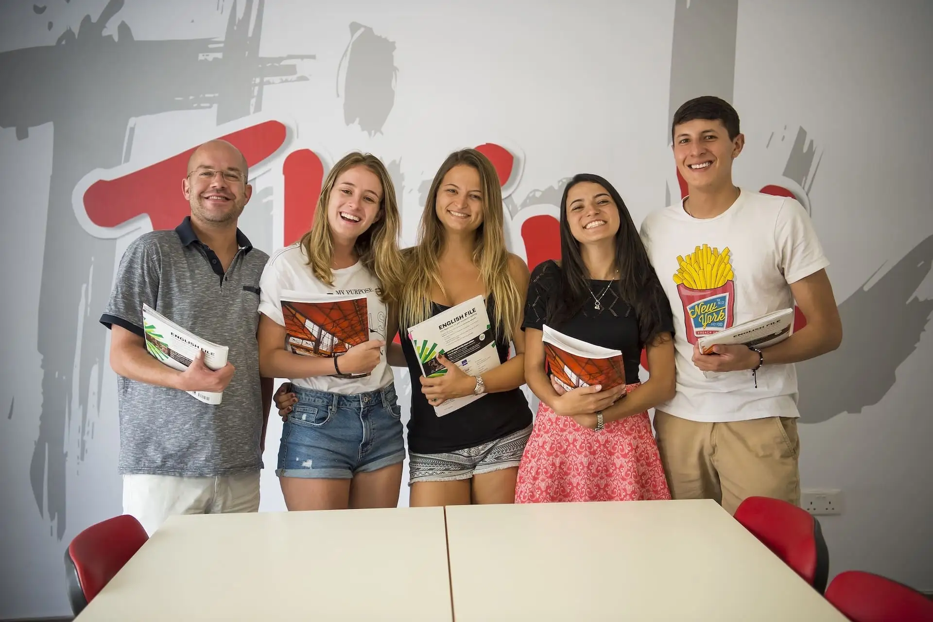 Group of students with their English File books at IELS Malta
