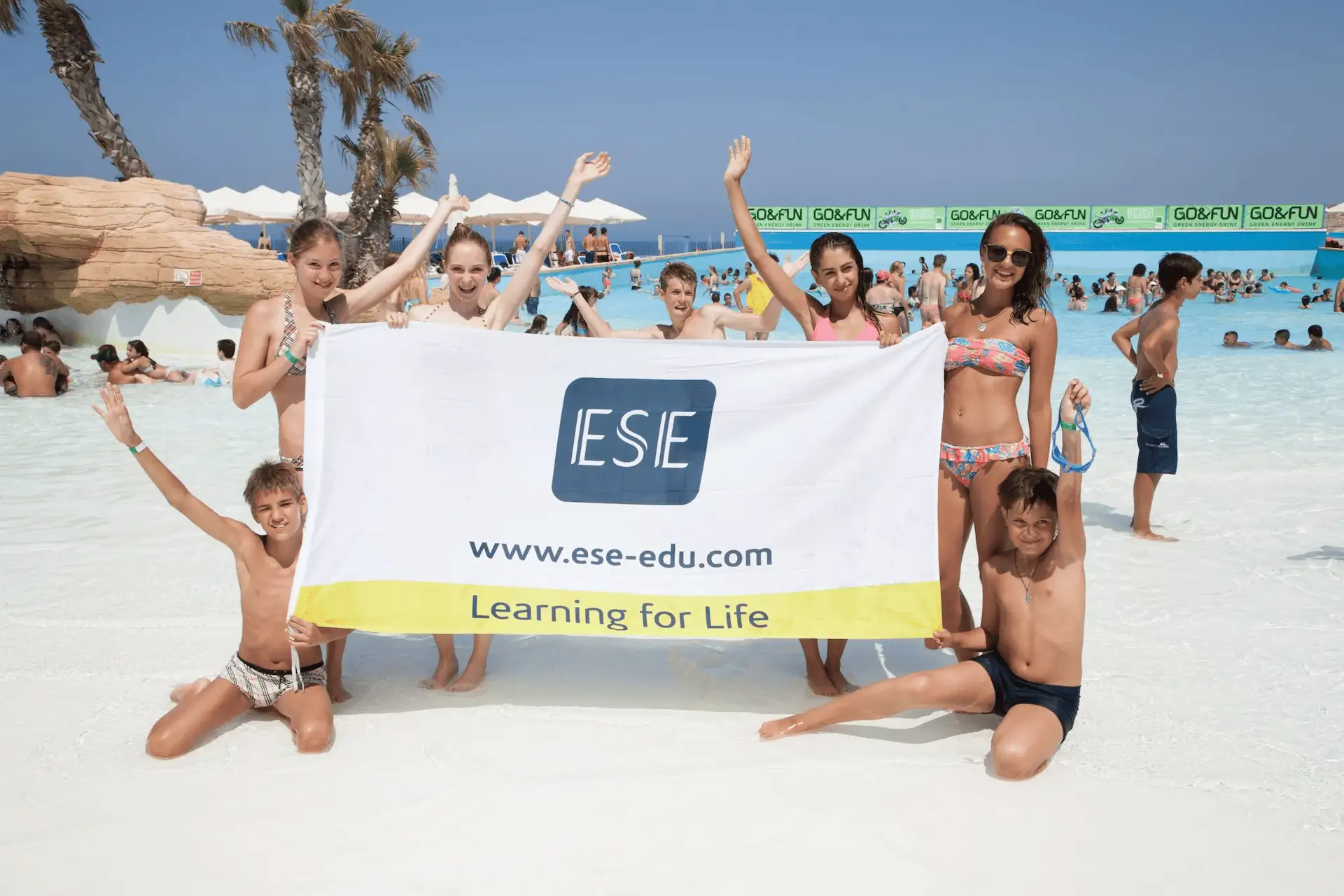 Teenagers on a language stay in Malta enjoying a seaside swimming pool