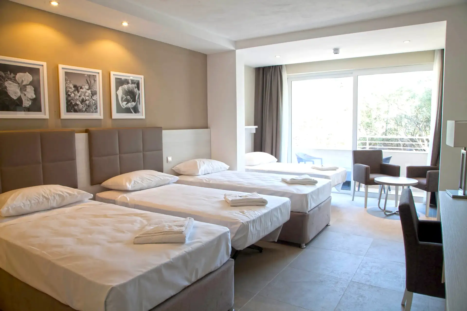 Room with four single beds at Salini Resort