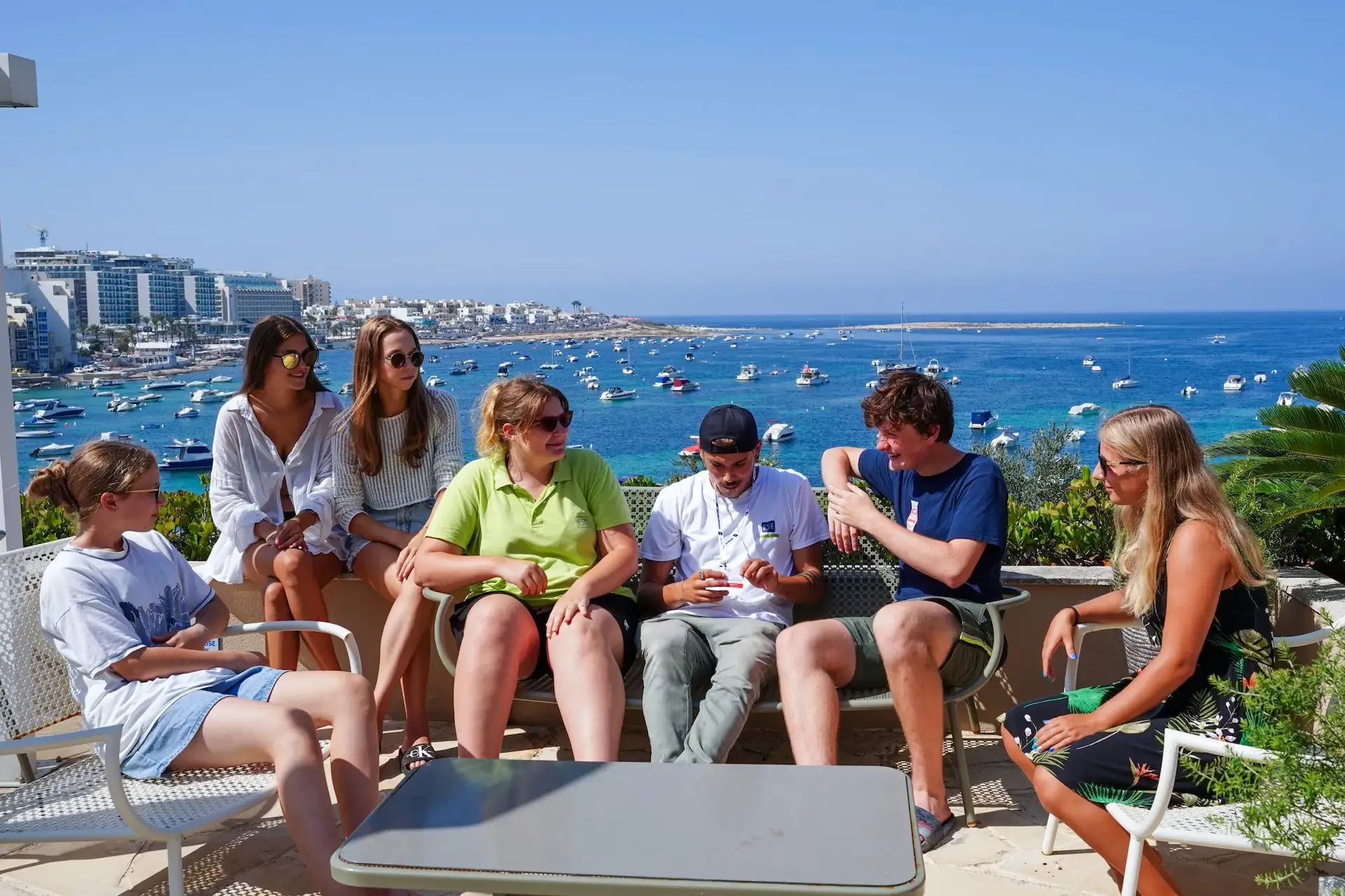 Group of young people on a terrace with sea view during a language stay in Malta