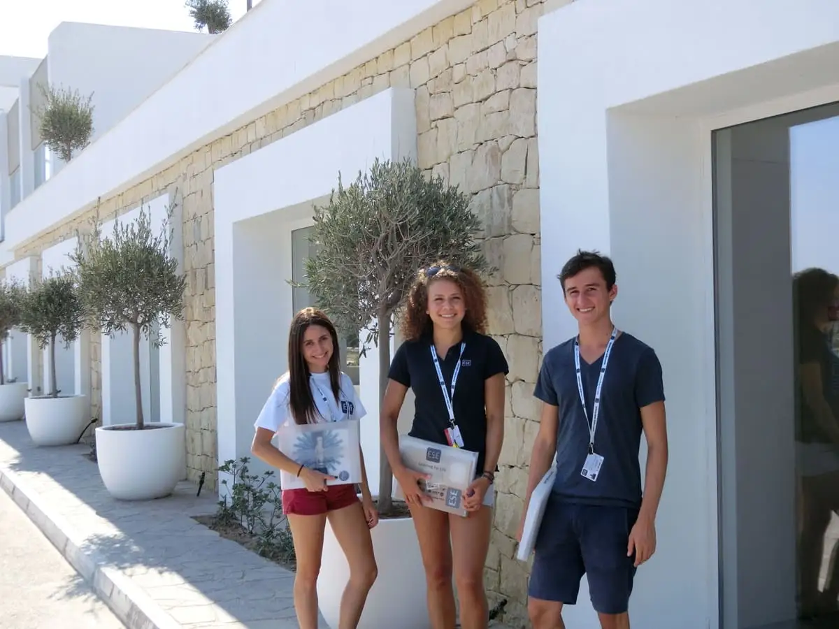 Students posing in front of the language stay accommodation in Malta