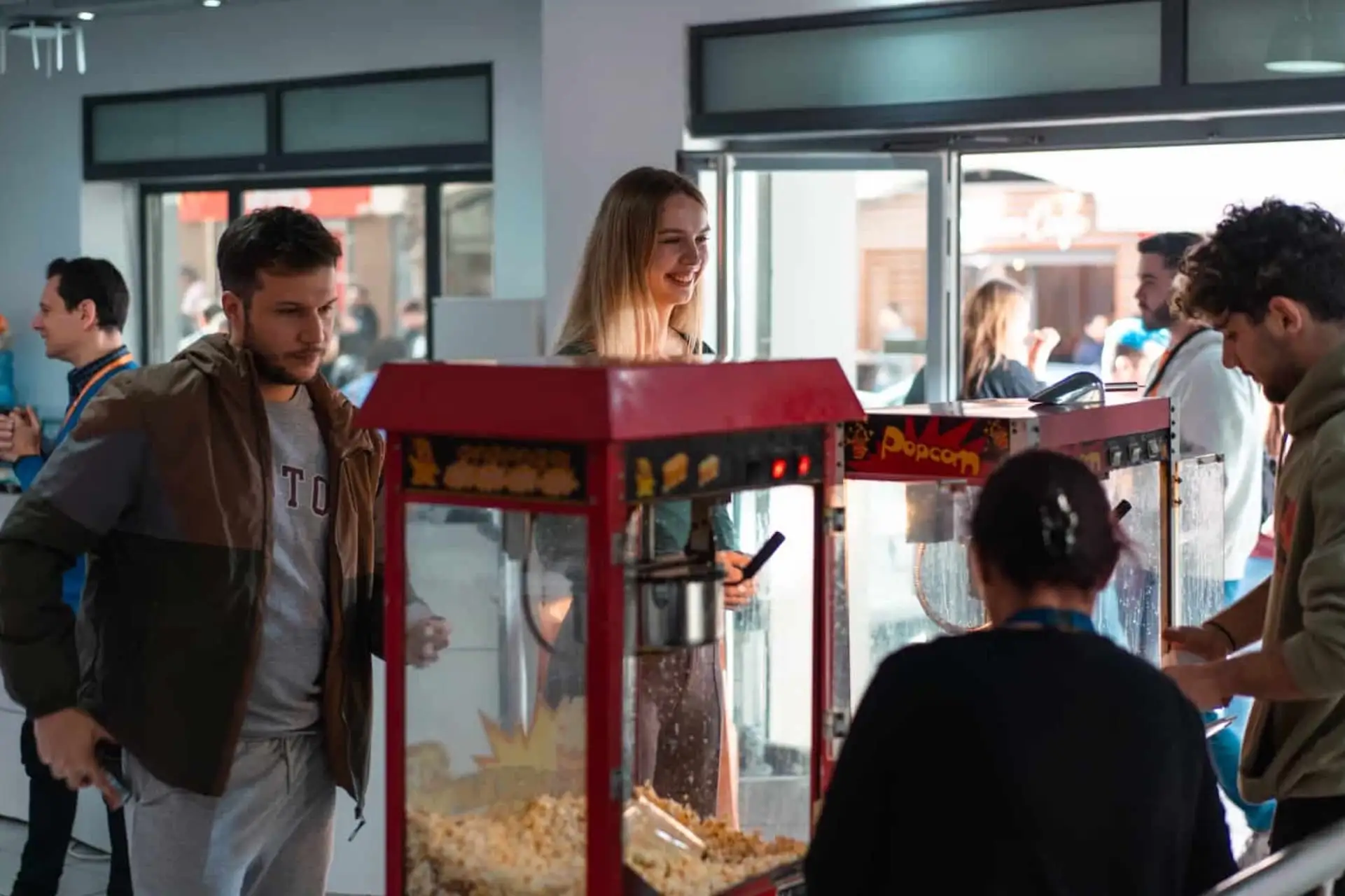 Students enjoying a popcorn machine at EC Malta school