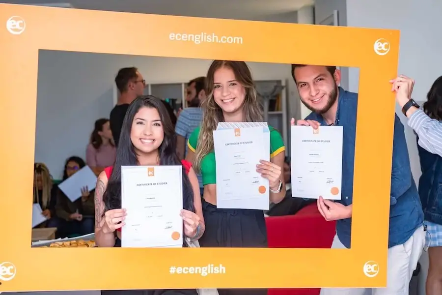 Students proudly displaying their graduation certificates at EC Malta