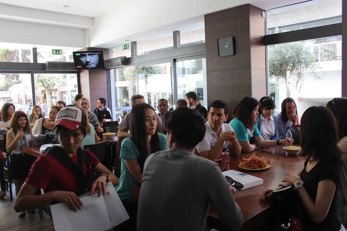 Students chatting and having a meal in the cafeteria at ESE school in Malta