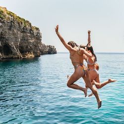 jump comino people jump into the water in comino
