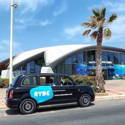 Ryde driver in front of the National Aquarium of Malta