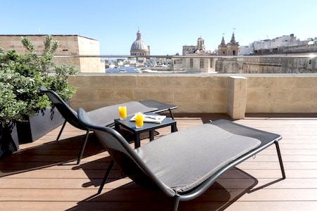 Terrace of the Hotel La Falconeria overlooking the dome of the Valletta Cathedral
