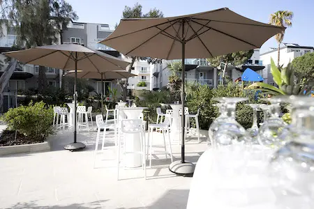 Outdoor Terrace with Chairs and Parasols at Urban Valley Resort